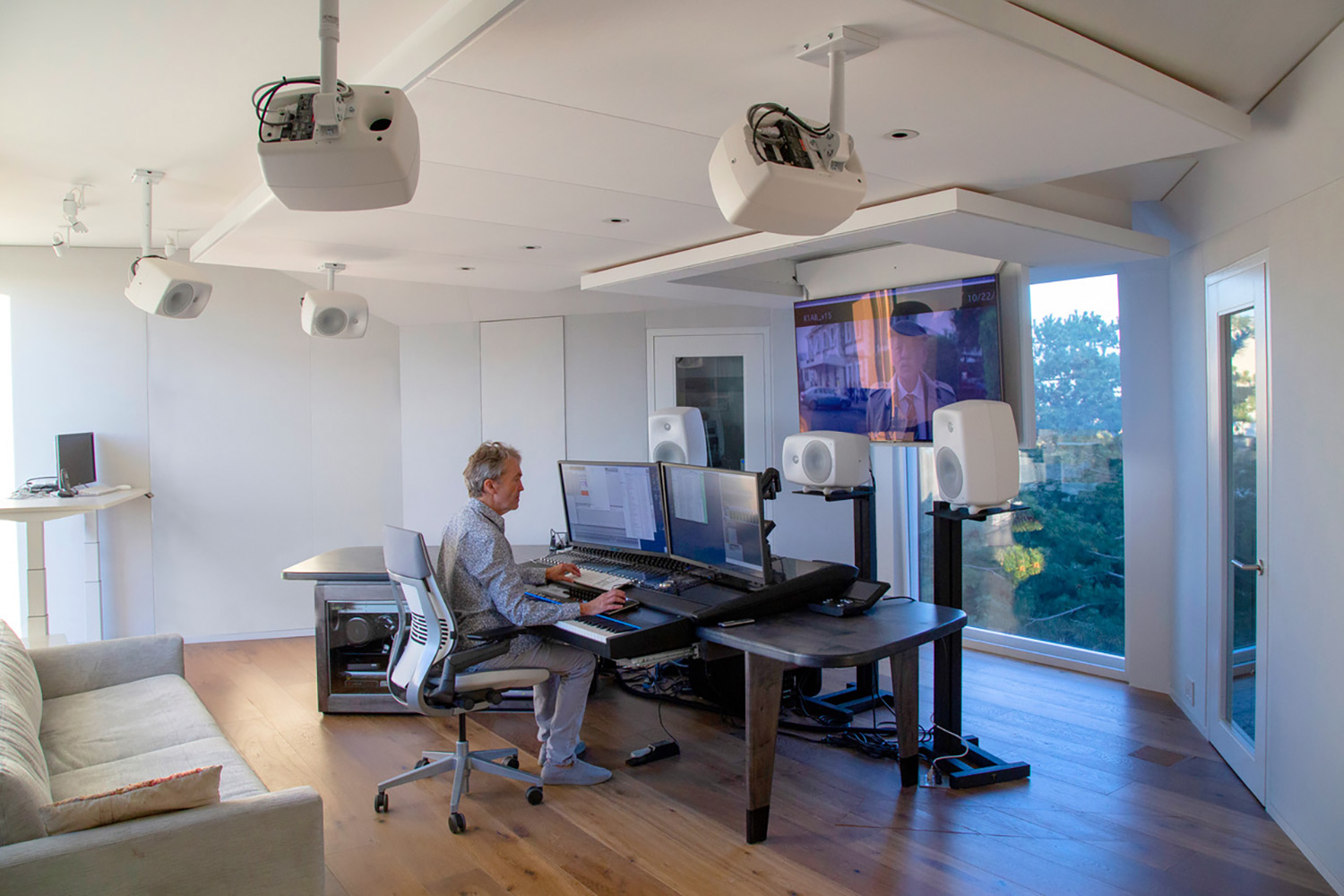 World-renown composer for films Carter Burwell returned to John Storyk and commissioned WSDG a new recording studio at his ultra modern Maziar Behrooz-designed home. Carter at his WSDG-designed studio working, side view.