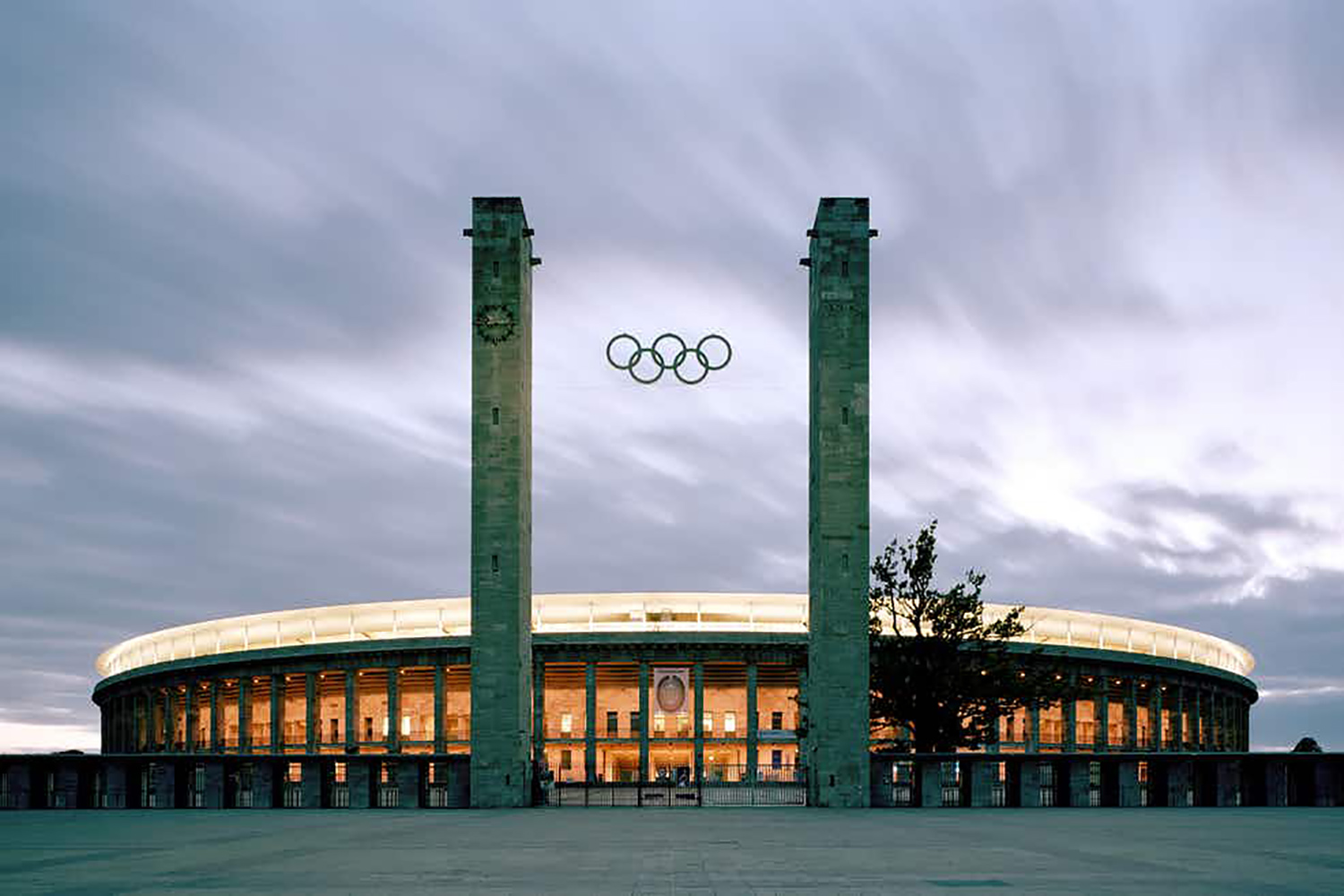 The Olympia Stadium Berlin is a Olympic and FIFA Germany 2006 World Cup Stadium, with a capacity of more than 70000 people. Extensive simulation calculations using the computer model were the core of work of ADA-AMC - WSDG. Exterior at night.
